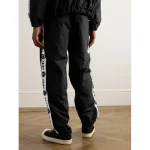 Black SAINT Mxxxxxx Logo Striped Nylon Track Pants Back