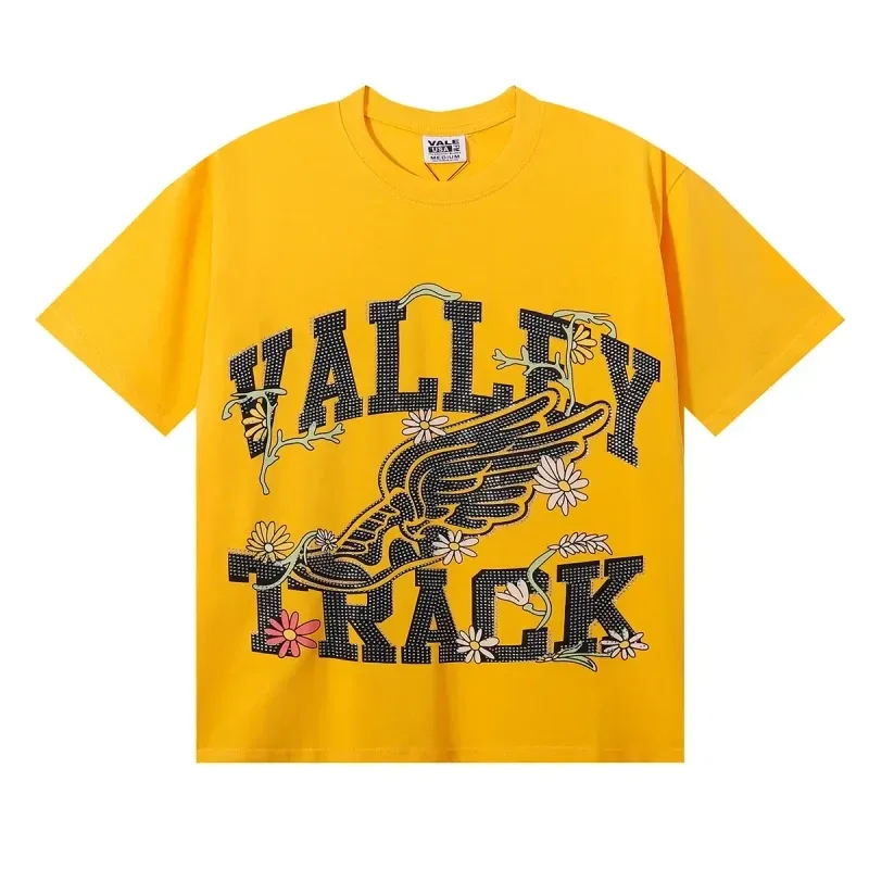 Vale Forever Valley Track Wing Graphic Tee ‘Yellow/Black/Floral’ Vale Forever Valley Track Wing Graphic Tee ‘Yellow/Black/Floral’